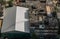 View from above on the white galvanized roof of the fresh market and old buildings deck at city