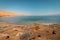 A view from above of a wild beach in the Dead Sea called Dragot Cliffs,