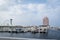 View of Abu Dhabi city famous Marina Mall, Marina eye wheel and Fairmont Marina Residences against cloudy sky