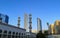 View of Abu Dhabi city World Trade Center Towers behind a mosque - Blue sky