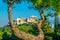 View of the Acropolis hidden behind a tree from the Filopappos hill in Athens, Greece....IMAGE