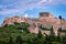 View of Acropolis hill and theater of Odeon in Athens, Greece from the hill of Philoppapos or Muses in summer daylight