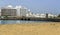 A view across a beach in Arrecife, Lanzarote towards the causeway and the shoreline