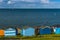 A view across the beach huts at Tankerton out into the Thames Estuary