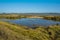 A view across the East Mersea flats and the Colne River towards Brightlingsea, UK