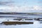 View across estuary from Northam Burrows Country Park, North Devon, England, light and shade.