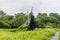 A view across the fens near Cambridge, UK towards a windmill