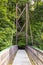 A view across the Inverted Bowstring Bridge across the Roe river in the Roe Valley country park near Limavady in County Londonderr