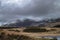 View across Llyn Dywarchen to a snow covered mount Snowdon in the Snowdonia National Park