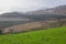 A view across one of the many snow topped hills and valleys of the Mourne Mountains in County down in Northern Ireland on a dull m