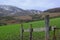 A view across one of the many snow topped hills and valleys of the Mourne Mountains in County down in Northern Ireland on a dull m