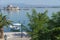 View across promenade to island Bourtzi with old fortress set in blue Mediterranean off-shore from Nafplio