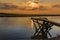 A view across the River Glaven at sunset in Blakeney, Norfolk, UK