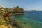 A view across the seafront in Acicastello, Sicily looking towards the Norman castle