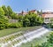 A view across the weir on the Selca Sora River in the town of Skofja Loka, Slovenia