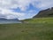 View on adalvik cove with rusty traktor and summer cottages at l