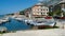 View on adrian harbour with boats and old village, mountain background