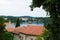 View of the Adriatic Sea with the roofs of the typical croatian houses and the green vegetation in the land, in Rovinj, Croatia