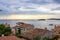 View of the Adriatic Sea with the roofs of the typical croatian houses and the green vegetation in the land, in Rovinj, Croatia