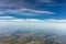 View from the airplane to the sky above the Alps mountains. Blue