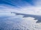 View from the airplane window, blue sky