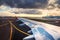 View of the airport and airplane wing from the Inside. Plane is ready to departure on the runway