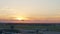 View of airport at sunset, plane taking off