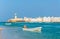 View of the Al Ayjah and a fishing boat town from a beach in Sur, Oman