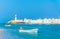 View of the Al Ayjah and a fishing boat town from a beach in Sur, Oman