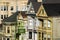 View on Alamo Square sign with detail of facades and exterior Painted Ladies architecture