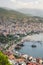 View of Alanya harbour from the top, southern coast of Turkey. Roofs, ships and mountains, turkish riviera