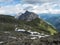 View on Alfairsee blue mountain lake and Innsbrucker Hutte mountain hut with moutain peak panorama at Stubai hiking