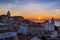 View of the Alfama neighborhood from the Portas do Sol viewpoint at sunrise in Lisbon, Portugal