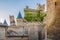 View of an alley and the back tower of the palace of the medieval town of Olite. Navarre Spain.