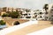 View of the alleys and white architecture and buildings of the fishing village of Binibeca Vell, Menorca, Spain during summer