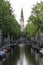 A view along an Amsterdam canal, towards the Zuiderkerk church