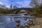 A view along the banks of  the River Orchy towards the Eighteen century bridge near to Glencoe, Scotland