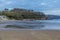 A view along the beach as the tide turns in Saundersfoot, Wales