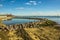 A view along the beach past the beach lagoon towards the longest pleasure pier in the world in the distance at Southend-on-Sea, UK