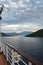 View along a boat deck to the mountains of Montenegro