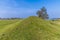 A view along the eastern ramparts of the Iron Age Hill fort remains at Burrough Hill in Leicestershire, UK