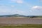 View along edge Morecambe Bay to Warton Crag