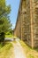 A view along the Nottolini aqueduct crossing a residential road in Lucca Italy