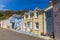 A view along a row of pastel coloured houses beside the harbour at Lower Fishguard, South Wales