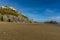 A view along the South Beach of the cliffs and Saint Catherine`s Island in Tenby, Pembrokeshire