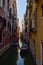 A view along a still, narrow Venetian canal