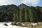 View on Alp mount with steep slope in foreground from tourist path heading directly towards to Murg lakes