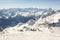 View of an alpine mountain with skiers