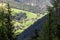 View of an alpine village on the slope of the Dolomites, Italian Alps