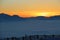 View of the alps at sunset, in winter. A layer of high fog over the valley of Salzburg, Austria.